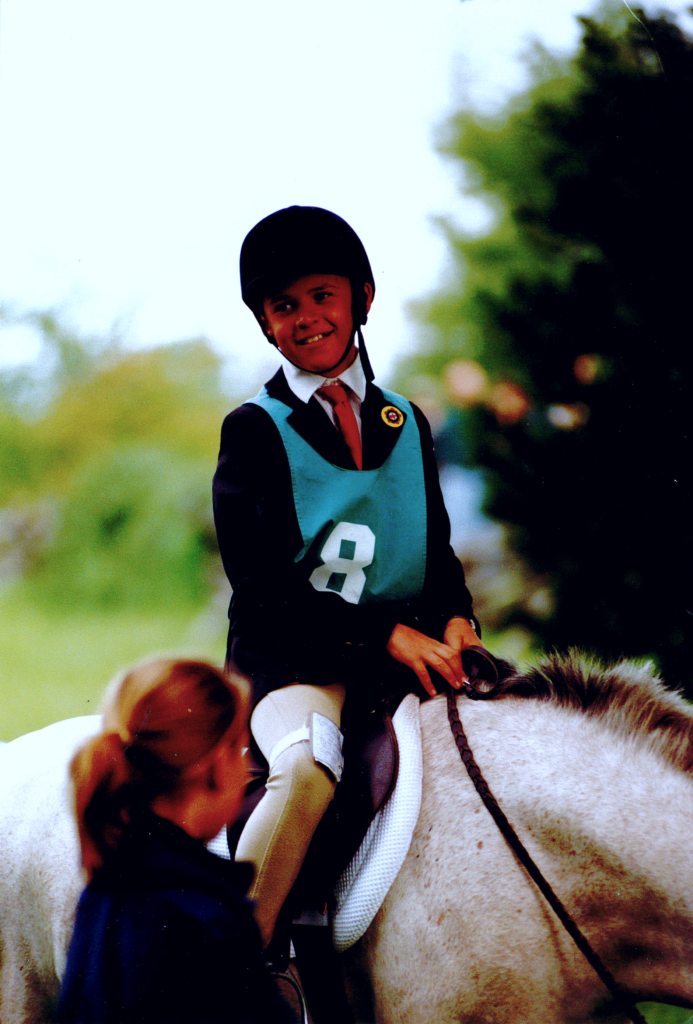 Portrait of a young Peter SZkotnicki horseback riding