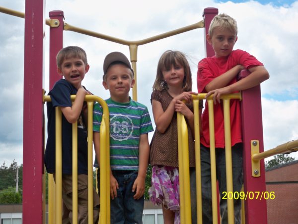 Participants of Guelph Mercury Kids-to-Camp program posing at a playground.