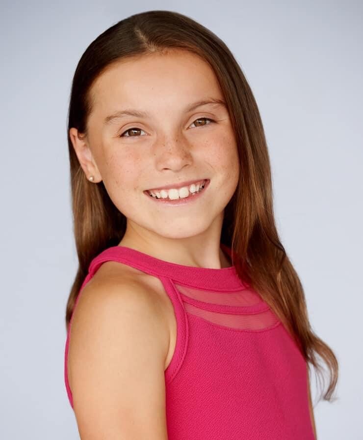 Portrait of Kayla Chadwick in a pink shirt