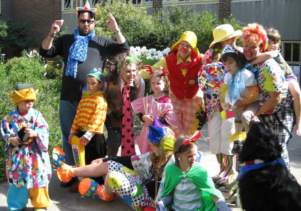 Participants of the program seen dressed in costumes and playing together.