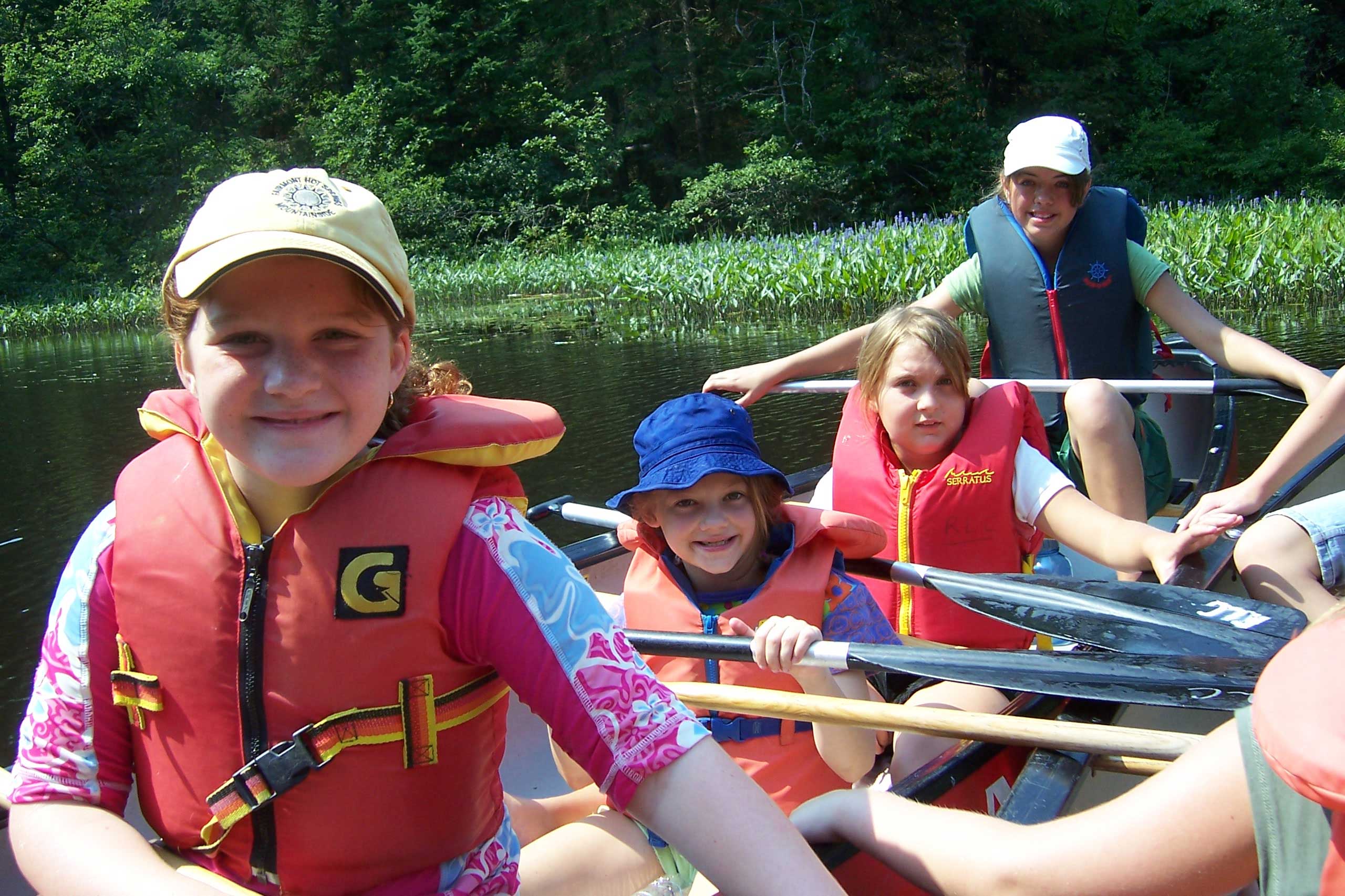 Kids canoeing in a lake