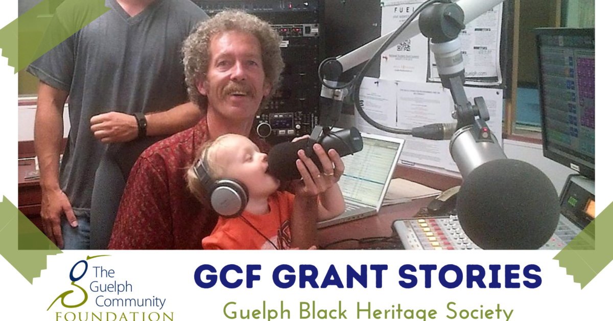 GCF Grant Stories Caption for photo: Curly haired Nick Taylor in the CFRU station with his son Malcolm and baby grandson Charlie holding a microphone