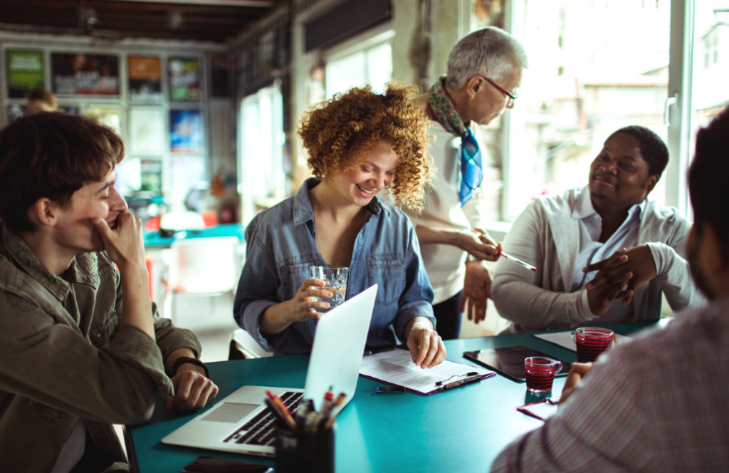 A group of diverse people working around a table