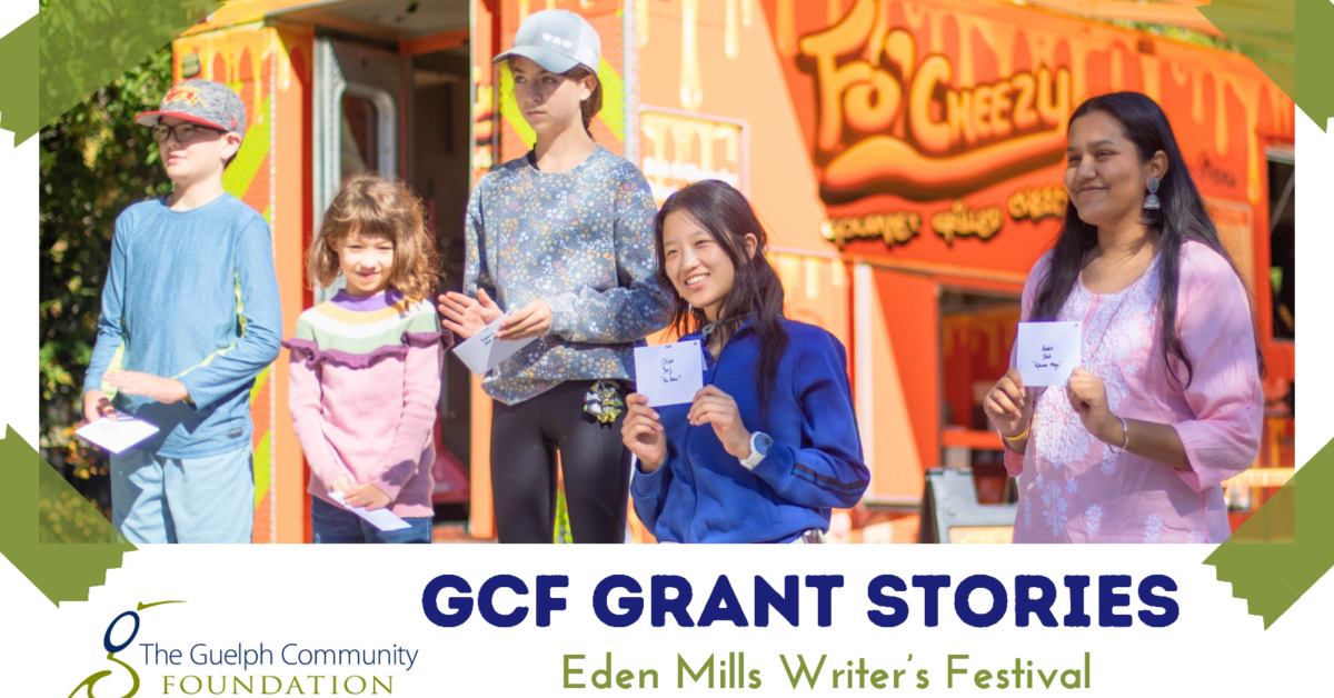 Group of children and teens holding papers, standing outdoors near a colorful food truck at Eden Mills Writer's Festival.